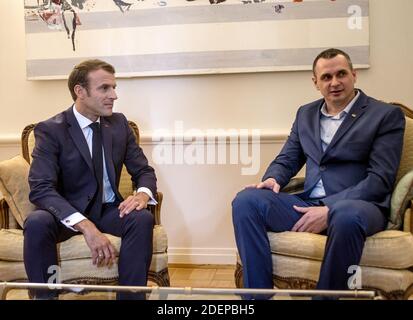 French President Emmanuel Macron (L) speaks with former Kremlin prisoner and Ukrainian film director Oleg Sentsov on October 01, 2019, at the permanent Representation of France to the Council of Europe in Strasbourg, northeastern France. Photo by Elyxandro Cegarra/Pool/ABACAPRESS.COM Stock Photo