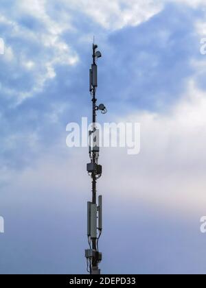 5G antenna pole for 5G telephone and internet communication, IOT Internet of things connections and millimeter wave transmission, isolated against a s Stock Photo