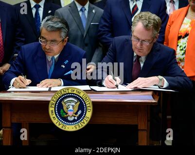 Ambassador Shinsuke Sugiyama, Ambassador of Japan to the United States, left, and US Trade Representative Robert Lighthizer, right, sign the US-Japan Trade Agreement and US-Japan Digital Trade Agreement in the Roosevelt Room of the White House in Washington, DC, USA on Monday, October 7, 2019. Photo by Ron Sachs/Pool via CNP/ABACAPRESS.COM Stock Photo