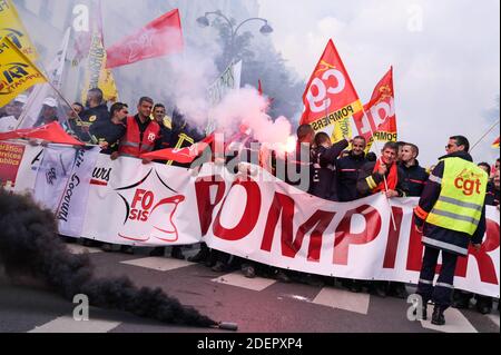 Protestors hold CGT union flags as people take part in a demonstration organized by firemen and hospitals in Paris, France, on October 15, 2019. Photo by Julie Sebadelha/ABACAPRESS.COM Stock Photo