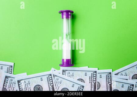 Many bills of 100 dollars, us banknote, green background with money cash currency close-up, concept time worth money Stock Photo