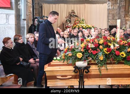 Late cyclist Raymond Poulidor's grandson Dutch cyclist Mathieu van der Poel (up) his widow Gisele Poulidor (L) and his daughter Corinne Poulidor (2L) attend the funerals of the French champion Raymond Poulidor in Saint-Leonard-de-Noblat on November 19, 2019. - French cyclist Raymond Poulidor died on November 13, 2019, at the age of 83. Photo by MEHDI FEDOUACH / Pool/ABACAPRESS.COM Stock Photo