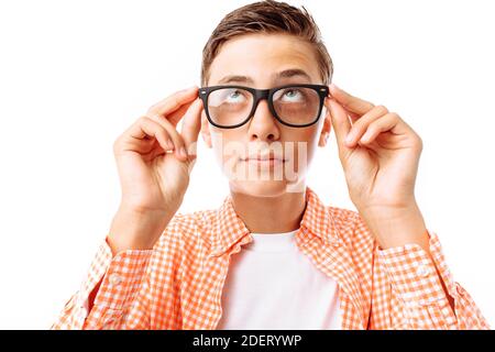 Closeup portrait of teenage boy with glasses, smiling face, in Studio on white background Stock Photo