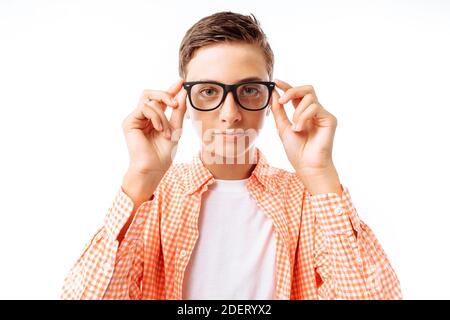 Closeup portrait of teenage boy with glasses, smiling face, in Studio on white background Stock Photo