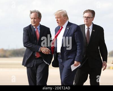 NO FILM, NO VIDEO, NO TV, NO DOCUMENTARY - Donald Trump greets Texas Attorney General Ken Paxton as Lt. Gov. Dan Patrick follows at Austin Bergstrom International Airport on Wednesday, Nov. 20, 2019 before his visit to the Apple campus. Photo by Jay Janner/Austin American-Statesman/TNS/ABACAPRESS.COM Stock Photo