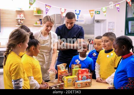 https://l450v.alamy.com/450v/2det3k3/handout-picture-kylian-mbappe-participates-in-a-cooking-workshop-with-children-to-teach-them-to-read-industrial-product-labels-and-the-benefits-of-homemade-foods-kylian-mbappe-is-the-ambassador-of-the-organic-brand-good-gout-kidz-this-event-was-initiated-and-organized-by-good-gout-at-the-good-planet-foundation-in-paris-on-november-20-2019-photo-robin-malard-good-gout-via-abacapresscom-2det3k3.jpg