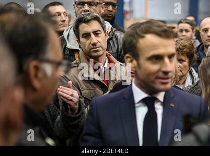 France's leftist party La France Insoumise (LFI) member of the Parliament, Francois Ruffin listens French President Emmanuel Macron talking with employees during his visit to the Whirlpool factory in Amiens, France, on November 22, 2019. Photo by Eliot Blondet/ABACAPRESS.COM Stock Photo