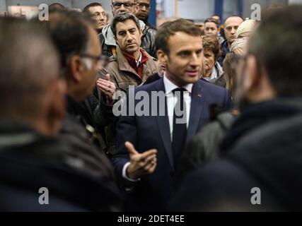 France's leftist party La France Insoumise (LFI) member of the Parliament, Francois Ruffin listens French President Emmanuel Macron talking with employees during his visit to the Whirlpool factory in Amiens, France, on November 22, 2019. Photo by Eliot Blondet/ABACAPRESS.COM Stock Photo