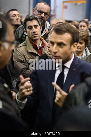 France's leftist party La France Insoumise (LFI) member of the Parliament, Francois Ruffin listens French President Emmanuel Macron talking with employees during his visit to the Whirlpool factory in Amiens, France, on November 22, 2019. Photo by Eliot Blondet/ABACAPRESS.COM Stock Photo