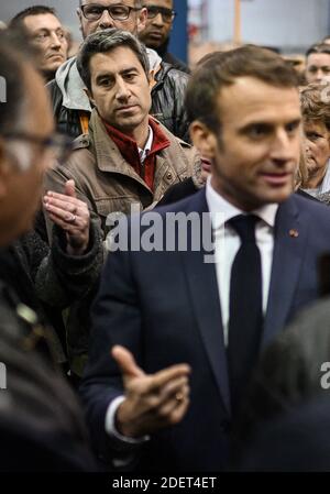 France's leftist party La France Insoumise (LFI) member of the Parliament, Francois Ruffin listens French President Emmanuel Macron talking with employees during his visit to the Whirlpool factory in Amiens, France, on November 22, 2019. Photo by Eliot Blondet/ABACAPRESS.COM Stock Photo