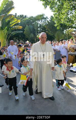 Pope Francis greets children before his depart for Japan, on November 23, 2019 at the Military Air Terminal at Don Muang airport in Bangkok, Thailand. Thailand was the first stop on a seven day Apostolic Journey to Asia taking him to Thailand and Japan. Photo: ABACAPRESS.COM Stock Photo