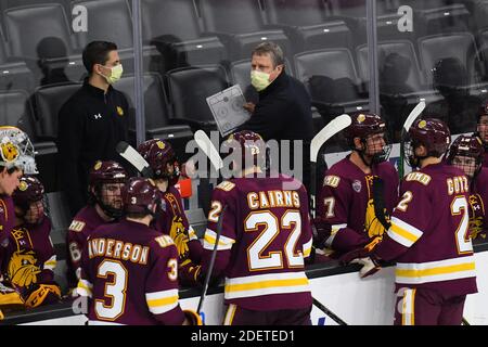 December 1, 2020 Minnesota Duluth head coach Scott Sandelin (center) addresses his team during a NCAA D1 men's hockey game between the University of Minnesota - Duluth Bulldogs and University of Nebraska - Omaha Huskies at Baxter arena in Omaha NE, home of the NCHC ''Hub'' where the first 38 NCHC games are being played under secure conditions to protect from Covid-19. MN Duluth won 5 to 3. Photo by Russell Hons/CSM Stock Photo