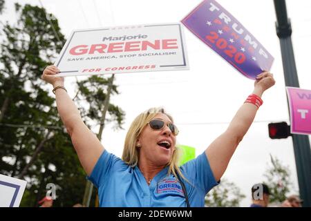 FILE - Rep. Marjorie Taylor-Greene, R-Ga., talks to reporters at the ...