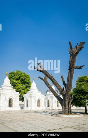 Kuthodaw Pagoda against sky on sunny day, Mandalay, Mandalay Region, Myanmar Stock Photo