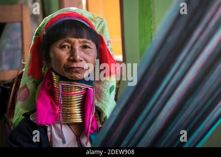 Portrait of senior Burmese woman from Kayan tribe weaving Stock Photo