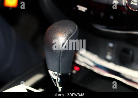 Gear lever in the car against the background of dashboard Stock Photo