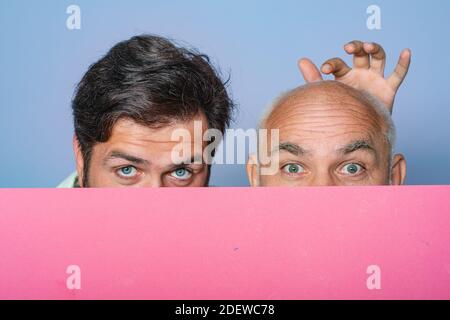 Bold senior man. Bald head. Portrait of a men combing himself. Hair transplantation. Bald man before and after surgery. Help with hair transplant Stock Photo