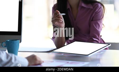 Cropped shot of young asian UI, UX front end designer team discussing ideas for new project  in meeting room. Stock Photo