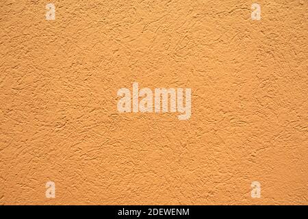 Orange colored background, with fine wall pattern Stock Photo