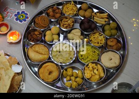 Mumbai / India 14 November 2020 Variety of Traditional Indian dishes on a thali and bowl served to Laxmi goddess as prasad during Diwali Puja Stock Photo