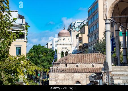 Athens, Greece, November 12, 2020. Buildings and Christian Orthodox Church of Madonna Pantanassa rooftops at Monastiraki square area. Police for impos Stock Photo