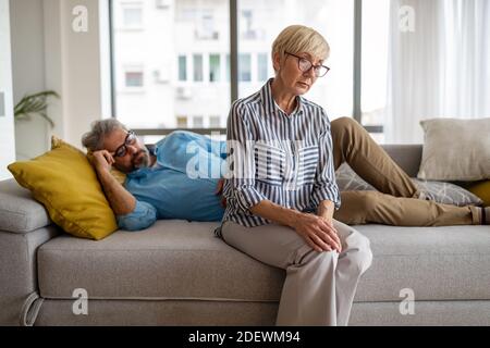 Handsome senior man and attractive old woman are having relationship problems Stock Photo