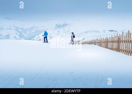 Saalbach, Austria - March 1, 2020: People skiing at ski slope of austrain winter resort Stock Photo
