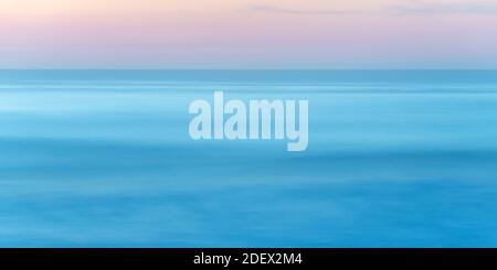 Long exposure of seascape at sunset Stock Photo