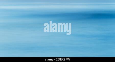 Long exposure of sea water, blue abstract background Stock Photo