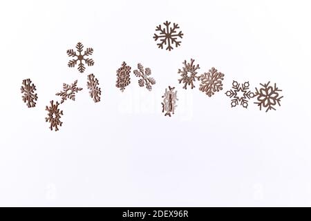 Snowflake pattern with falling snowflakes on a white background with copy space Stock Photo