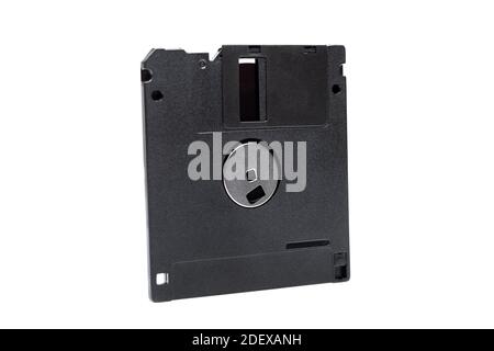 floppy diskette in a black square plastic case with open magnetic disk, obsolete computer technology device memory carrier 90s isolated on white backg Stock Photo