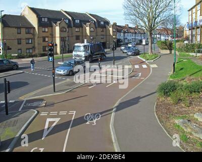 Remodelled road junction with bike lanes; Lea Bridge Road / Wood Street, London, UK. Part of Waltham Forest's 'Mini-Holland' safer streets initiative. Stock Photo