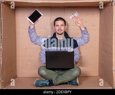 working on the Internet brings income for a young man Stock Photo