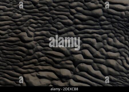 Abstract black tones stone, Pattern and detail grooved of black rock for background and abstract Stock Photo
