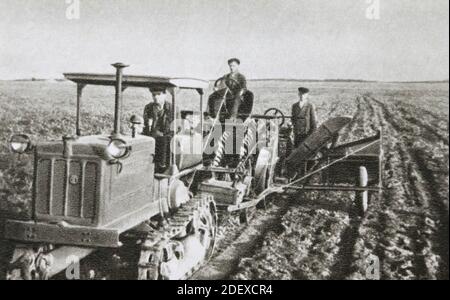 A beet harvester harvesting sugar beets on the Nové Zhittya collective farm in the Gaysinsky district (Ukraine) of the USSR in the 1950s. Stock Photo