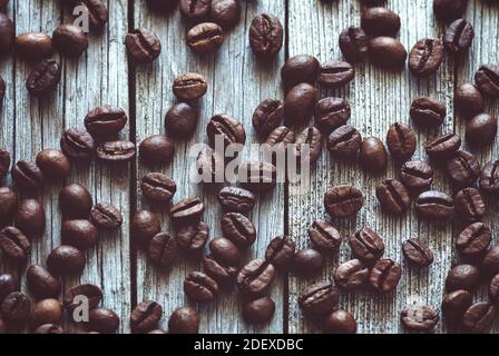 coffee beans on old wooden surface Stock Photo