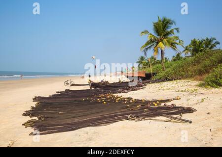 India, Goa, Colva beach, Fishermen mending nets Stock Photo