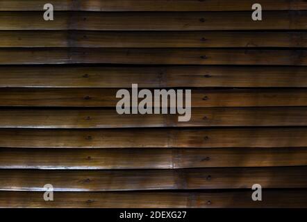 Bamboo wood surface, rustic table top view. Simple bamboo table top view. Dark wooden texture with planks. Natural material contrast background Stock Photo
