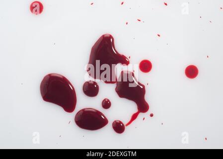 drops of blood, on a white background. view from above drop of blood isolated on white background Stock Photo