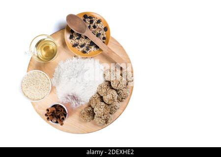 Making a cookies from different vegan inredients onb big wooden plate, isolated on a white. Stock Photo