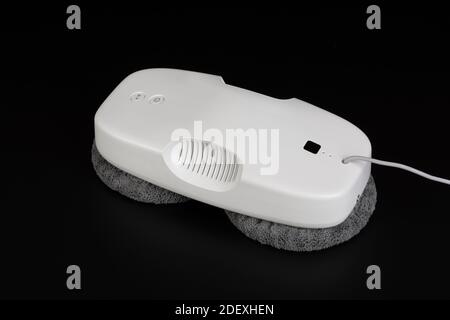 White window cleaning robot on black background. Stock Photo