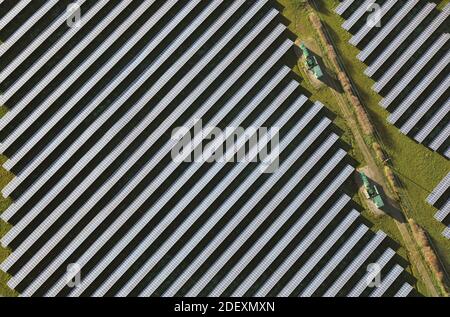 close-up almost vertical aerial view of solar panels on a solar farm in England, UK Stock Photo