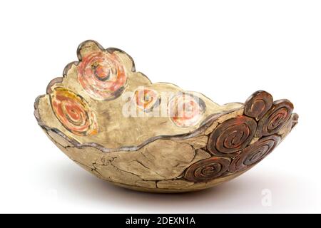 clay bowl on white background - handmade pottery Stock Photo
