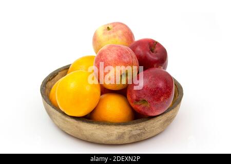 fresh fruits in a clay bowl - oranges and apples Stock Photo