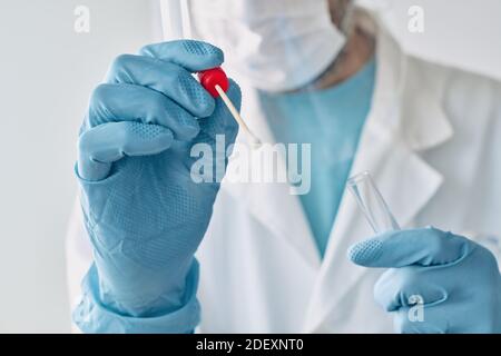 Medical professional performing oral swab Covid-19 test, selective focus Stock Photo