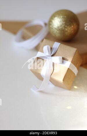 Christmas. Christmas Gift Boxes with Golden Ornaments on White Background. Stock Photo