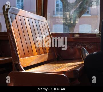 NEW ORLEANS, LA - NOVEMBER 20, 2020:  Foot resting on bench seat inside St. Charles Avenue streetcar Stock Photo