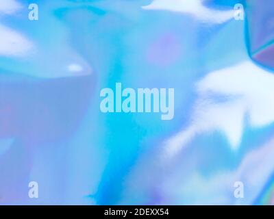 Beautiful holographic rainbow abstract background in pastel and neon color design. Real photography shot of holographic foil for creative project - design fashion, cover, book, printing. Copy space Stock Photo