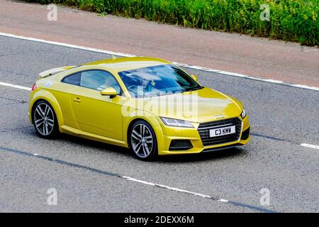 2017 yellow Audi Tt S Line Tdi Ultra; Vehicular traffic, moving vehicles, cars, vehicle driving on UK roads, motors, motoring on the M6 motorway highway UK road network. Stock Photo