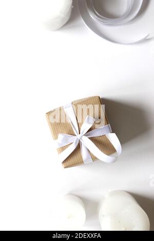 Christmas Flatlay. Overhead Composition of Gift Box, Candles, Ribbons. Stock Photo